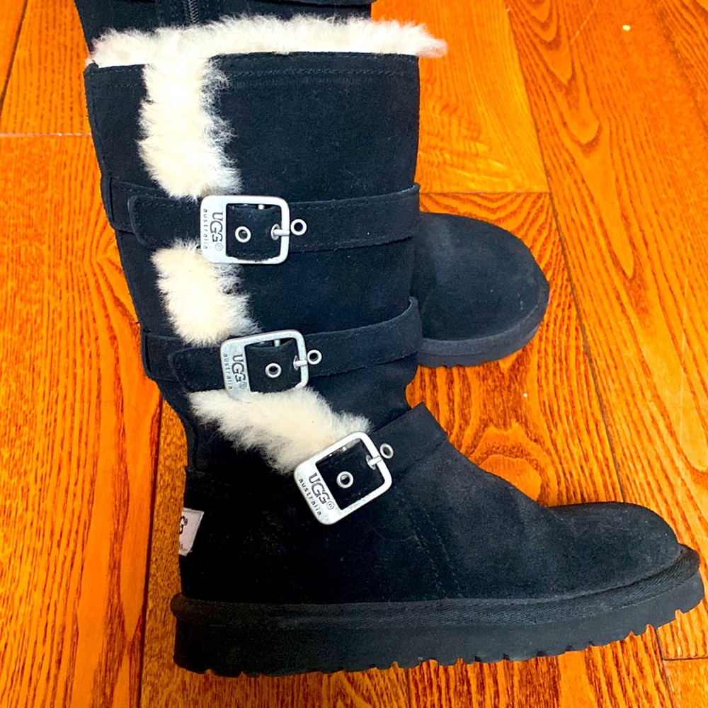 Never been worn UGGs . Black with three cute buckles on the side